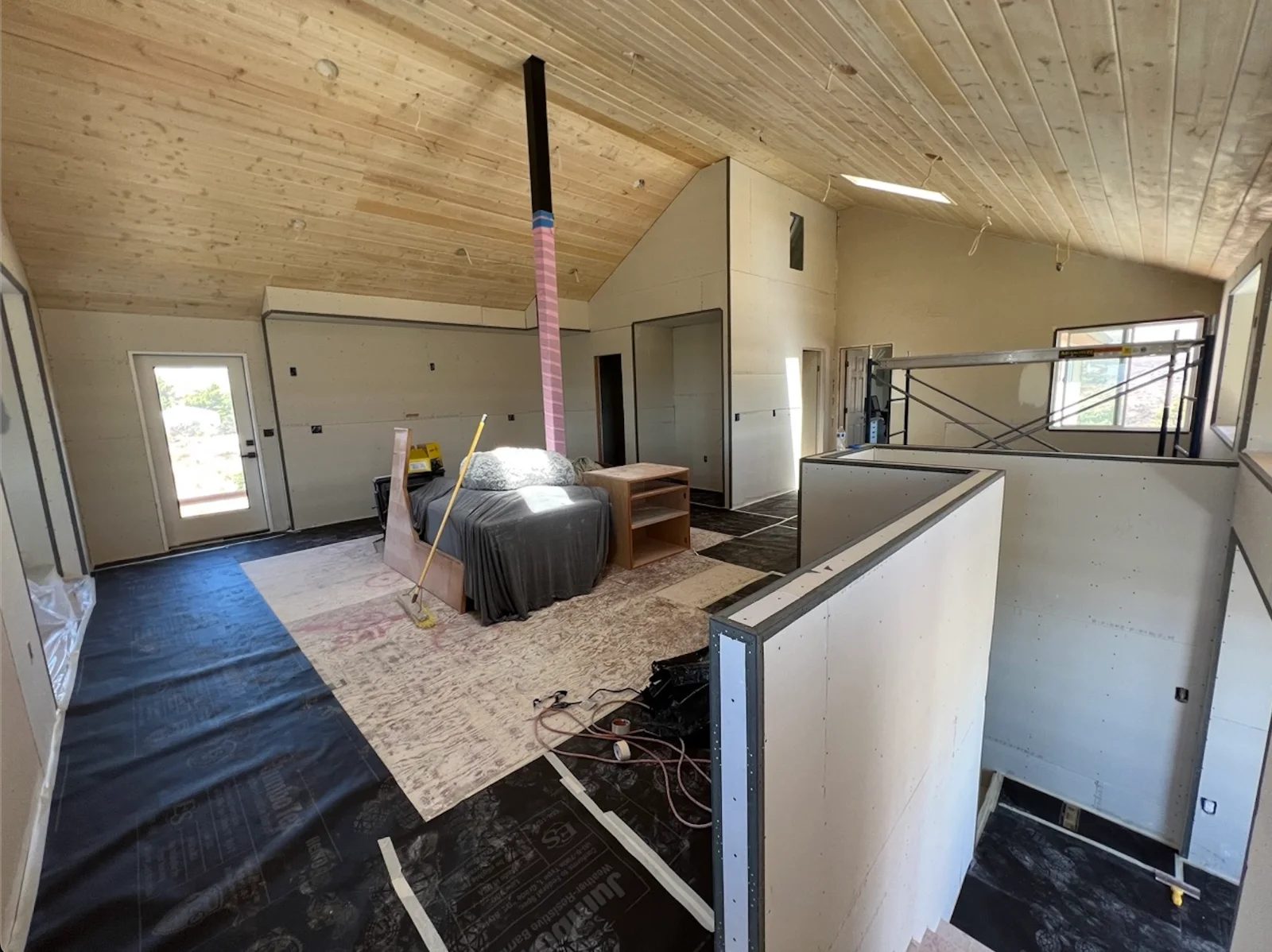 Completed ADU interior with new drywall and a vaulted tongue-and-groove ceiling