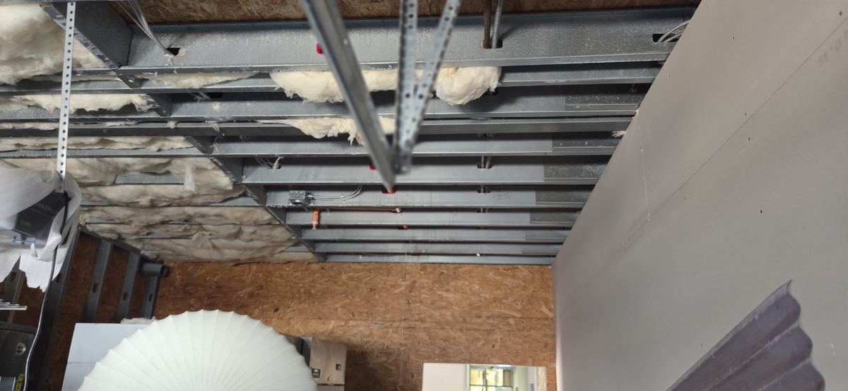 Ceiling framing set out around fixtures and services.