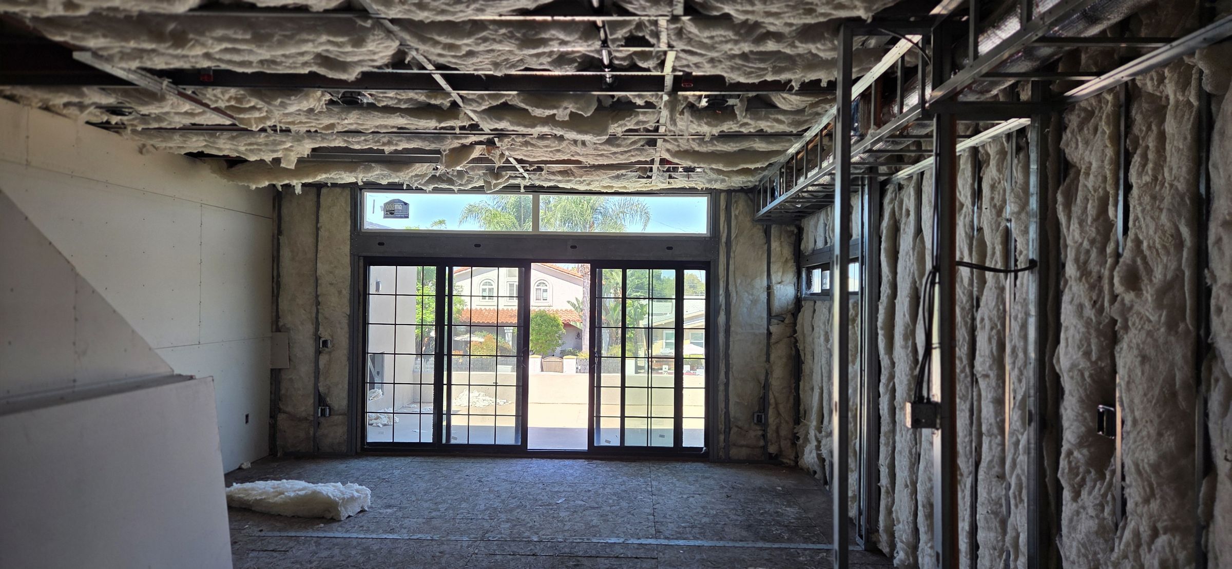 Commercial interior framed out to the storefront glazing during a fit-out