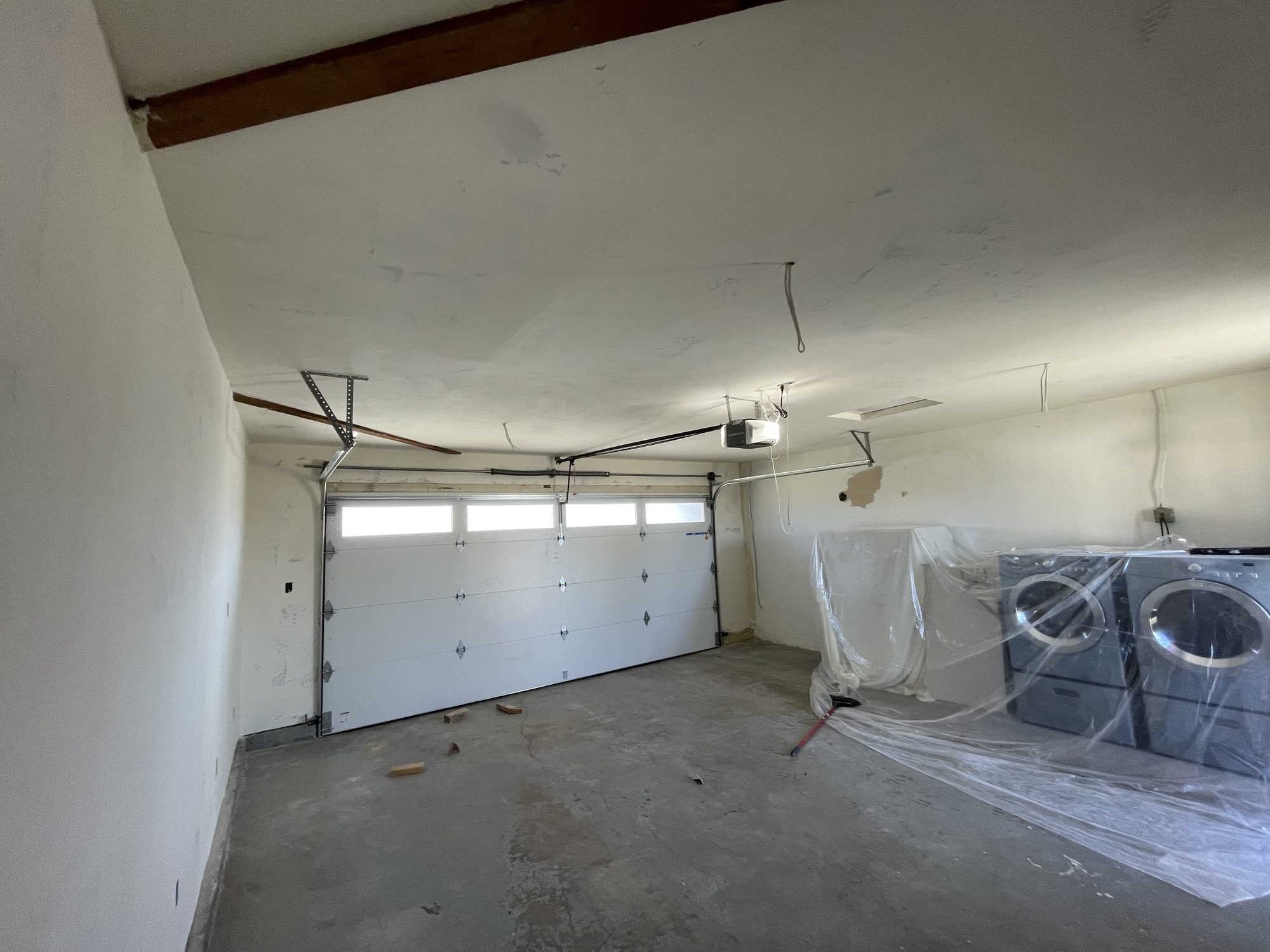 Finished interior with new drywall walls and ceiling, smooth and painted